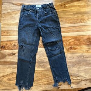 Pantalon noir délavé en bonne condition